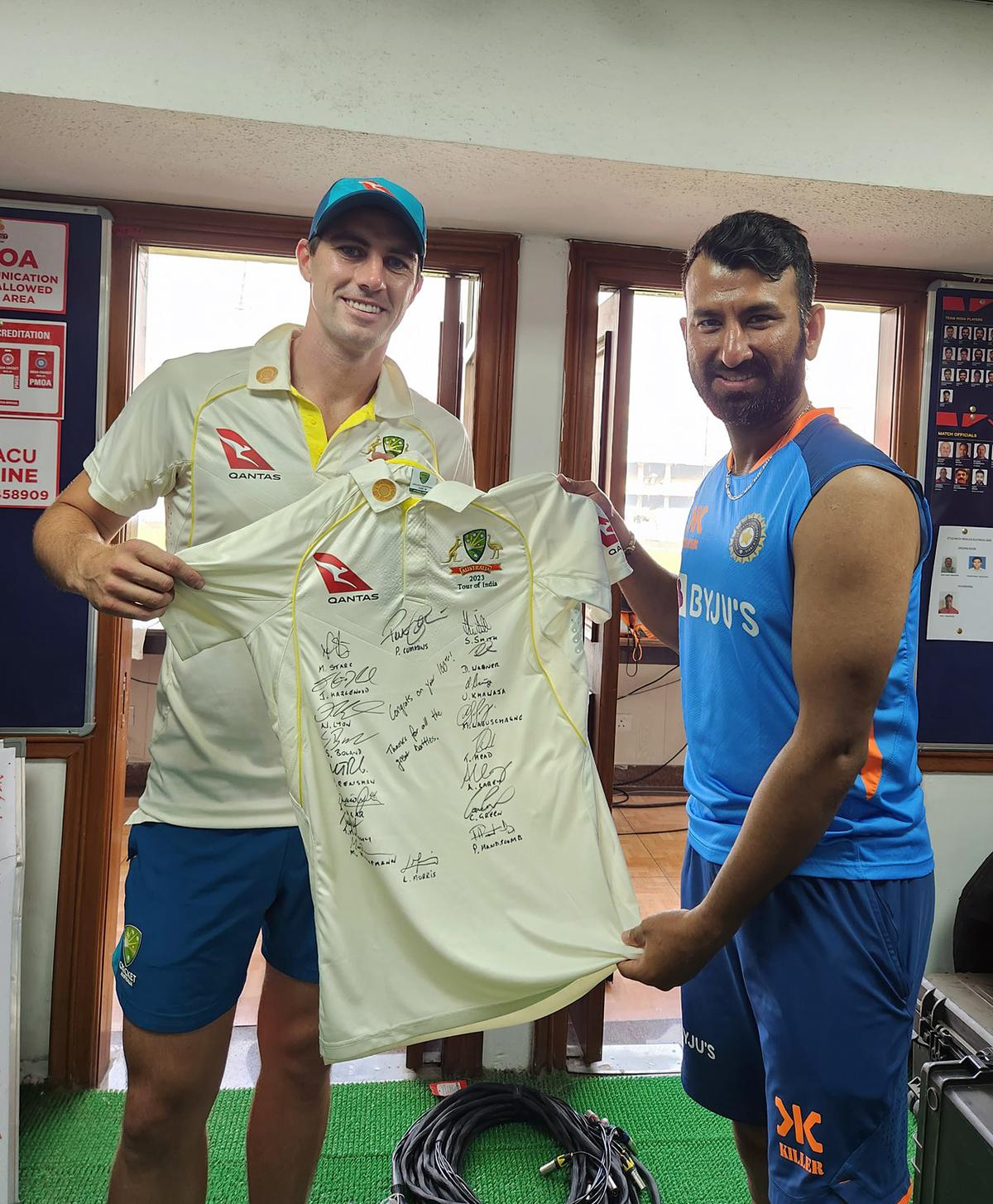 Australian skipper Pat Cummins gifted a signed jersey to Cheteshwar Pujara, commemorating Pujara’s 100th Test match appearance after the third day of the second test match, at Arun Jaitley Stadium, in New Delhi on Sunday. India won the match by 6 wickets | Photo Credit: ANI